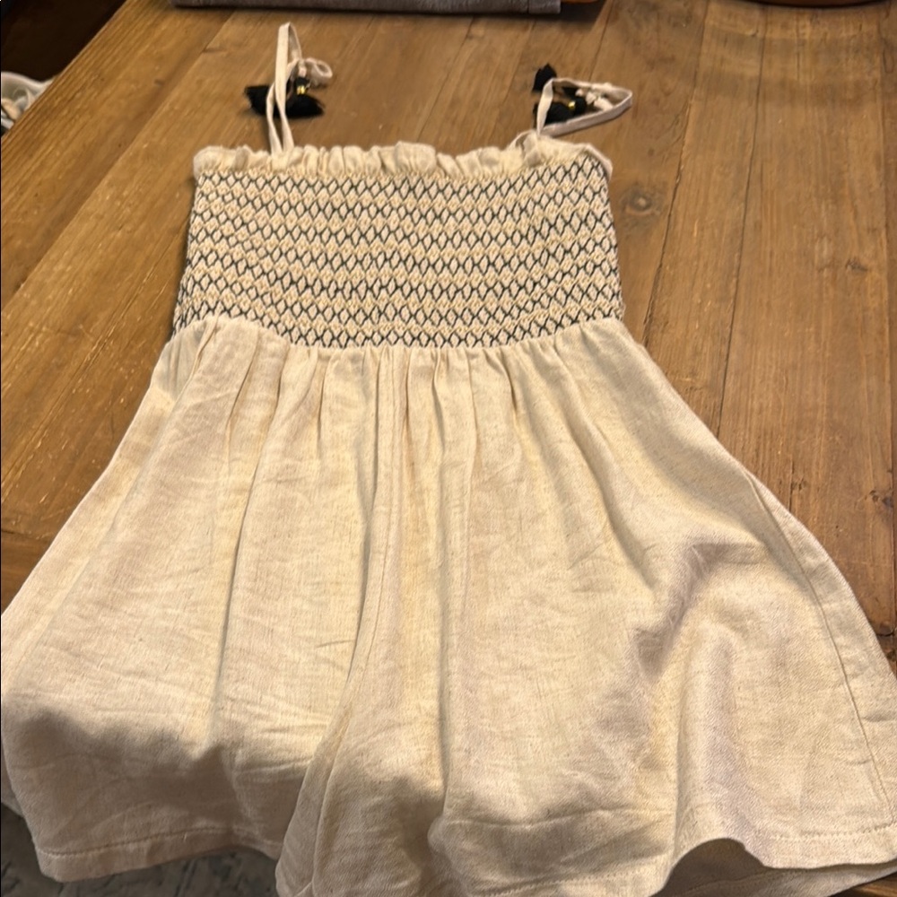 Cream and Black Patterned romper Mayoral size 12. Excellent condition.